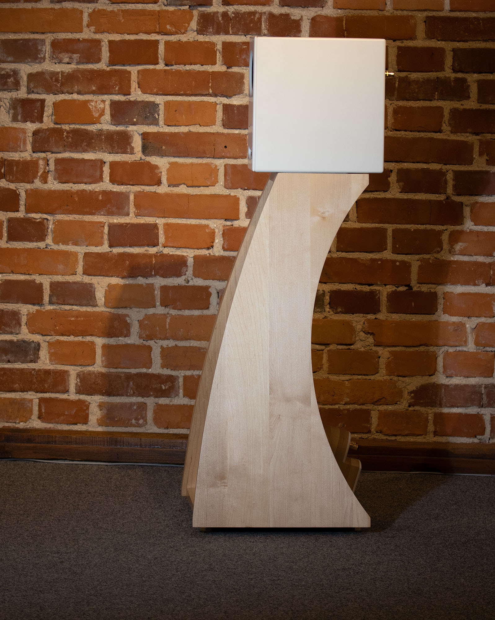 Profile view of the Closer Acoustics The Full OGY Loudspeaker Set – Pair in solid maple finish, highlighting the sophisticated shape and top-tier craftsmanship