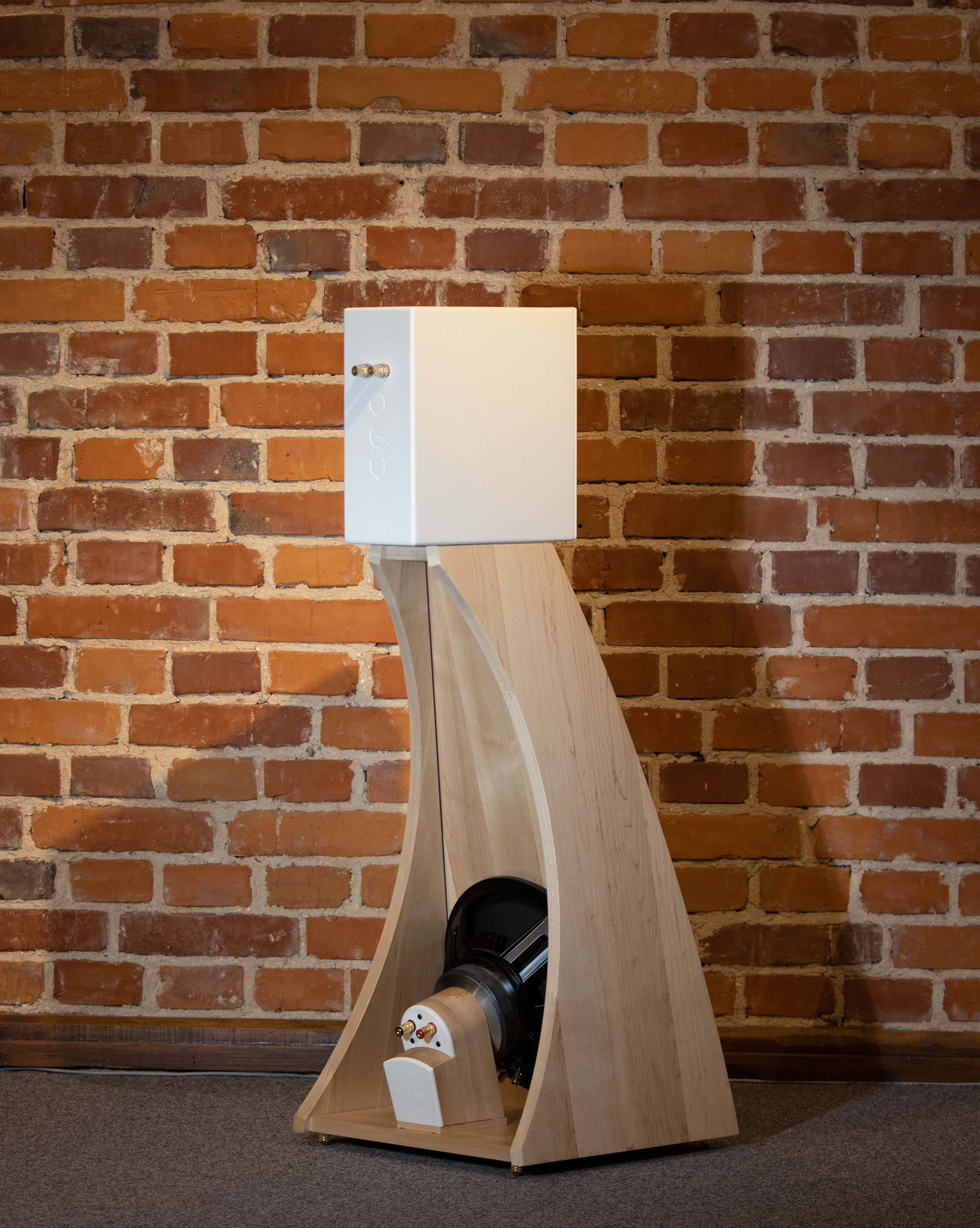 Side view of the Closer Acoustics The Full OGY Loudspeaker Set – Pair from the back, showing the solid maple finish and rear design details
