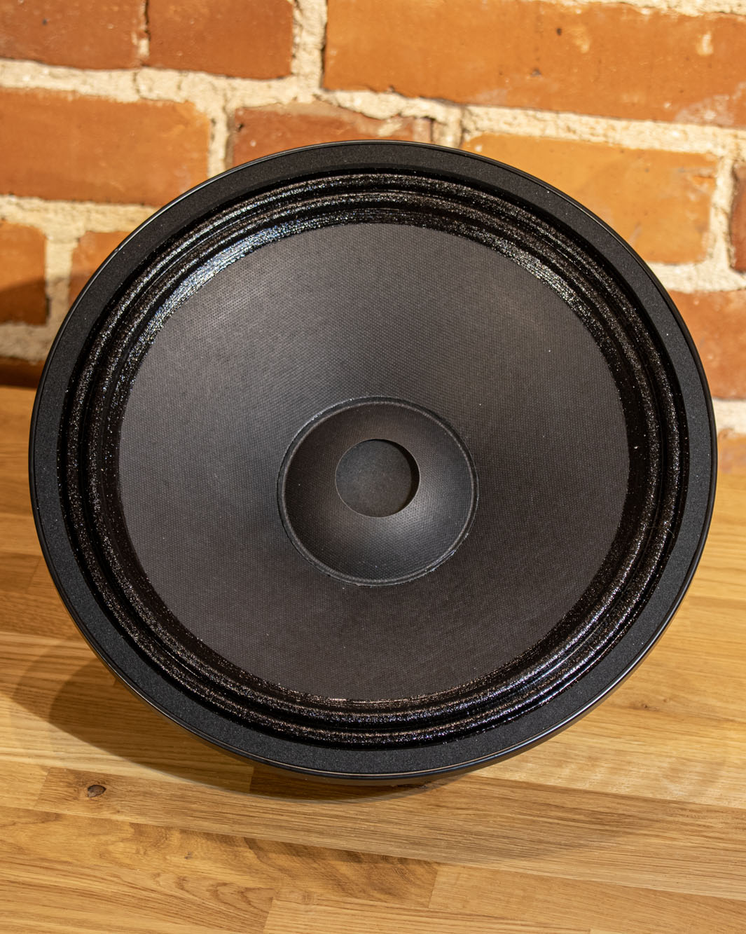 Front view of EMS B12 OB (No1214) bass driver 8 Ohm, showcasing its robust design and precision engineering for deep, clear bass performance