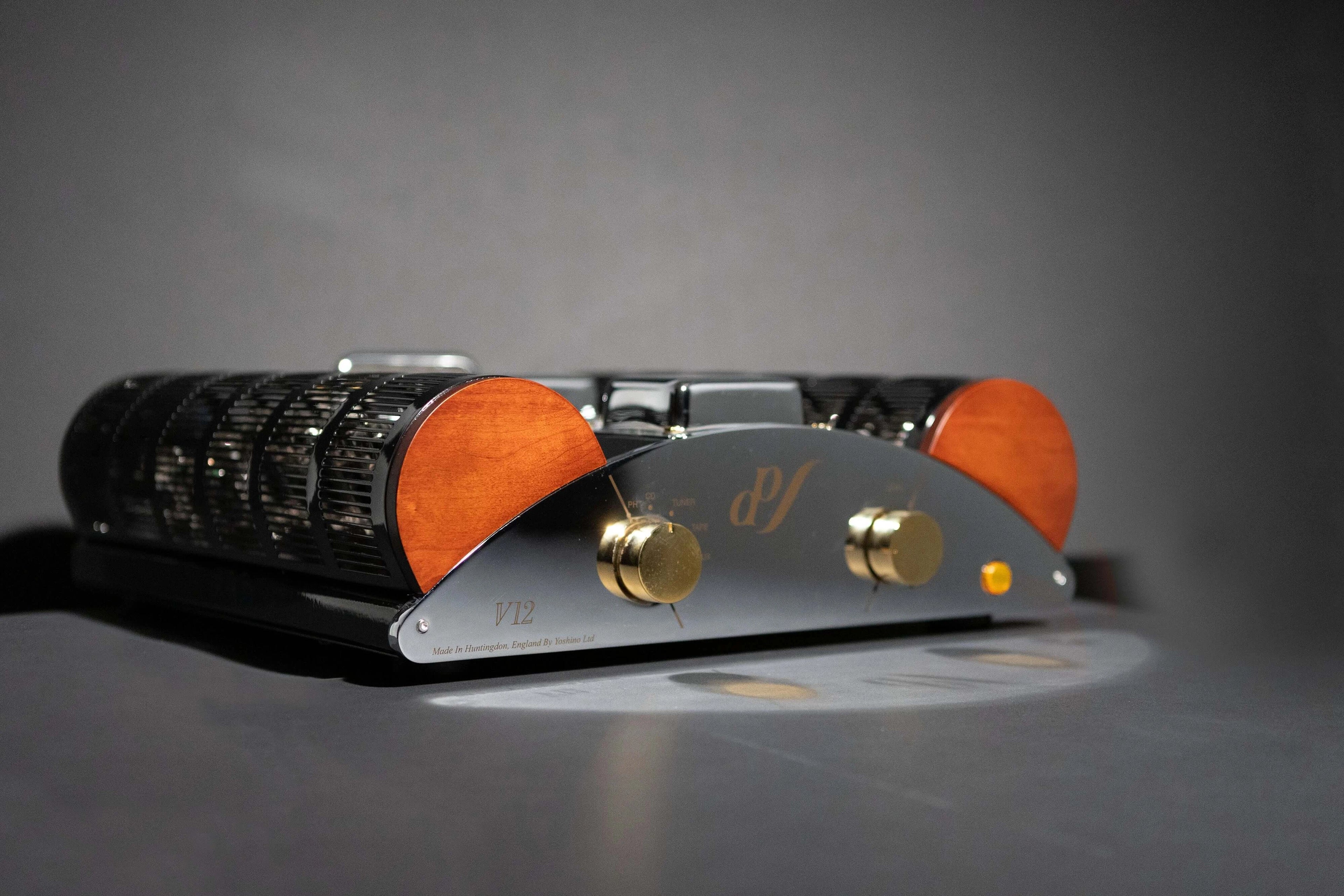 Side view of the EAR Yoshino EAR V12 integrated amplifier, showcasing its compact size and classic design