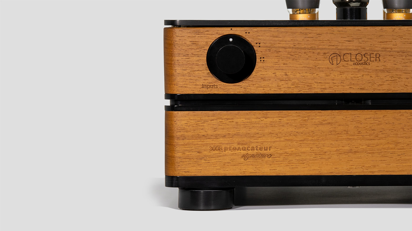 Close-up view of the knobs on the Closer Acoustics 300B Provocateur Signature integrated amplifier in Iroko finish, focusing on the precision and elegance of the controls.