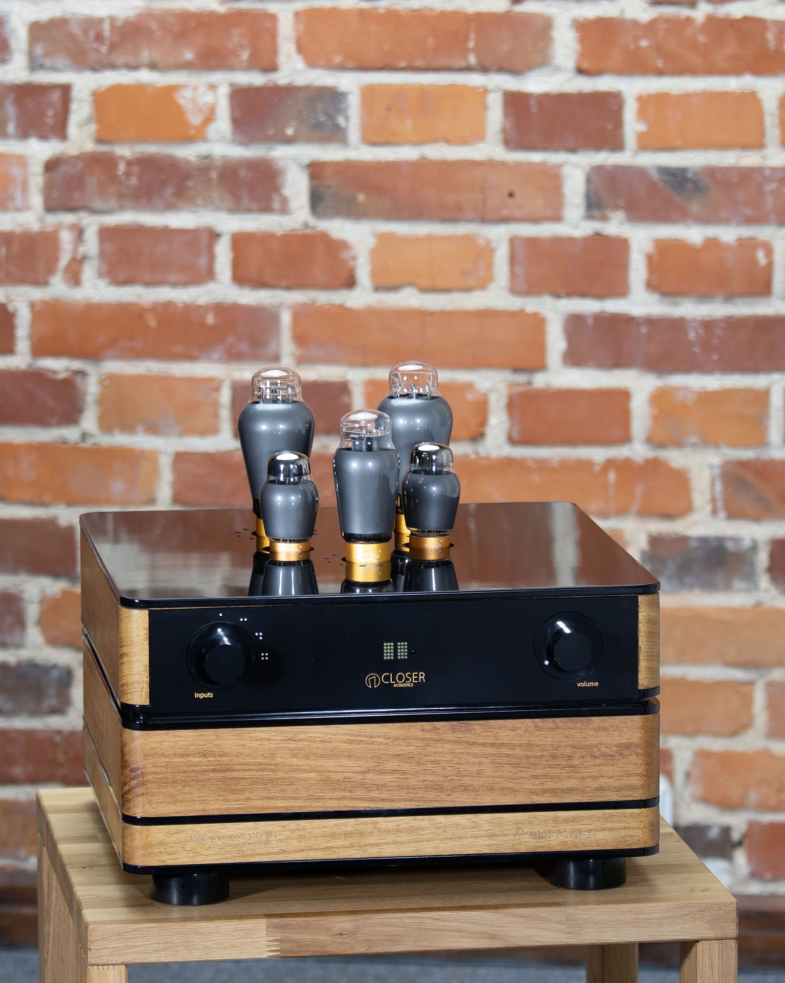 300B Provocateur Signature amplifier on wooden table – Iroko wood finish