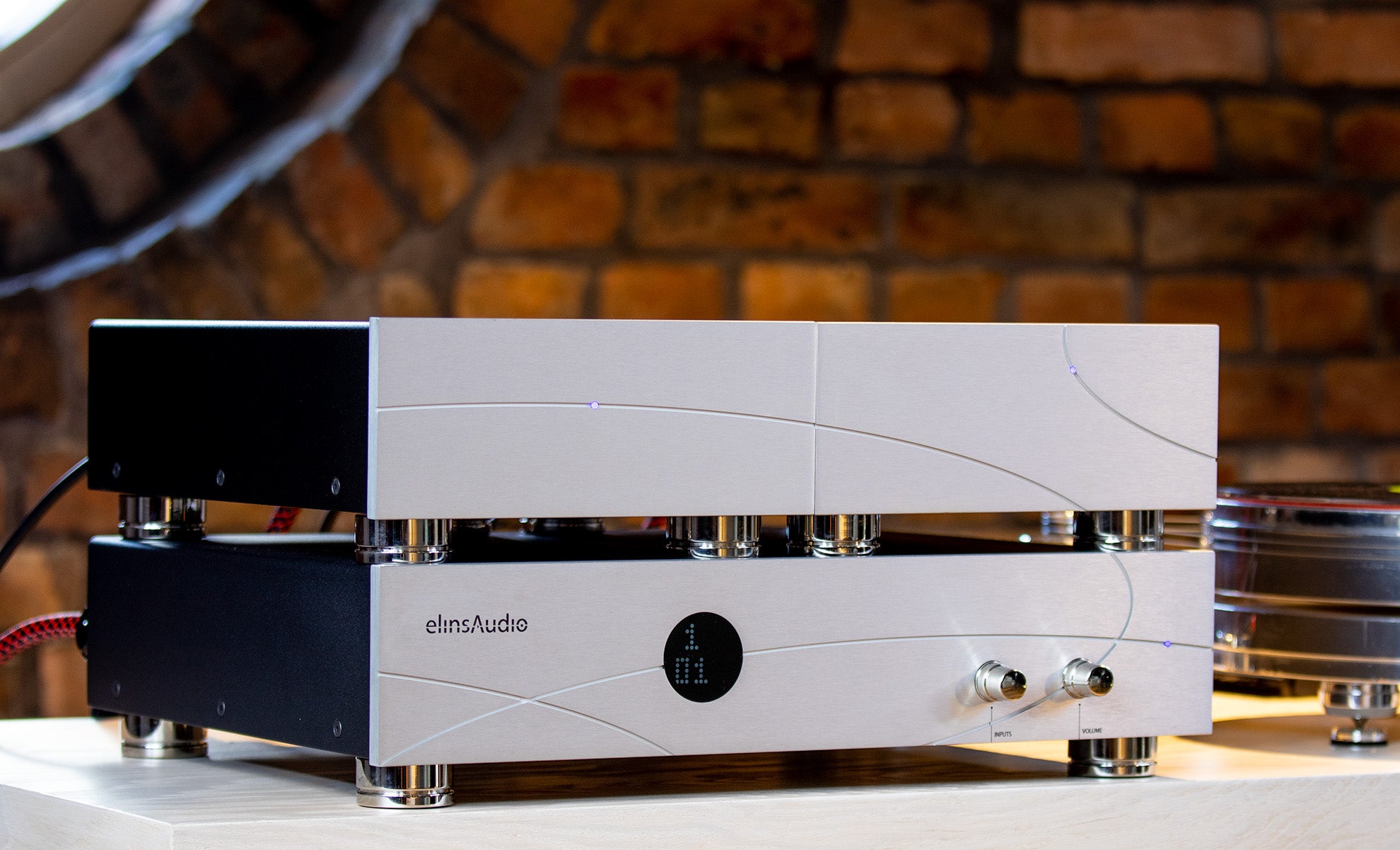 Full view of the elinsAudio Mille Reference amplifier in a studio setting, highlighting its high-end design and sophisticated finish.