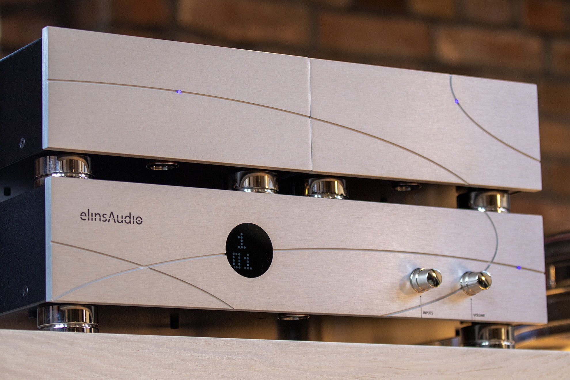 The elinsAudio Mille Reference amplifier displayed in a clean, minimalist environment, emphasizing its luxurious craftsmanship and modern audio technology.