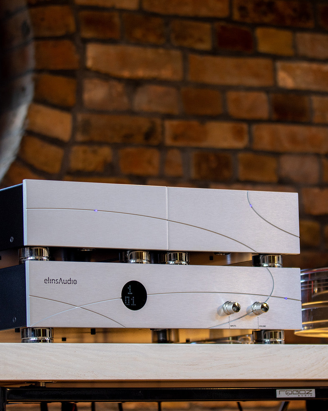 Front view of the elinsAudio Mille Reference amplifier, showcasing its sleek and sophisticated design with high-quality finish.