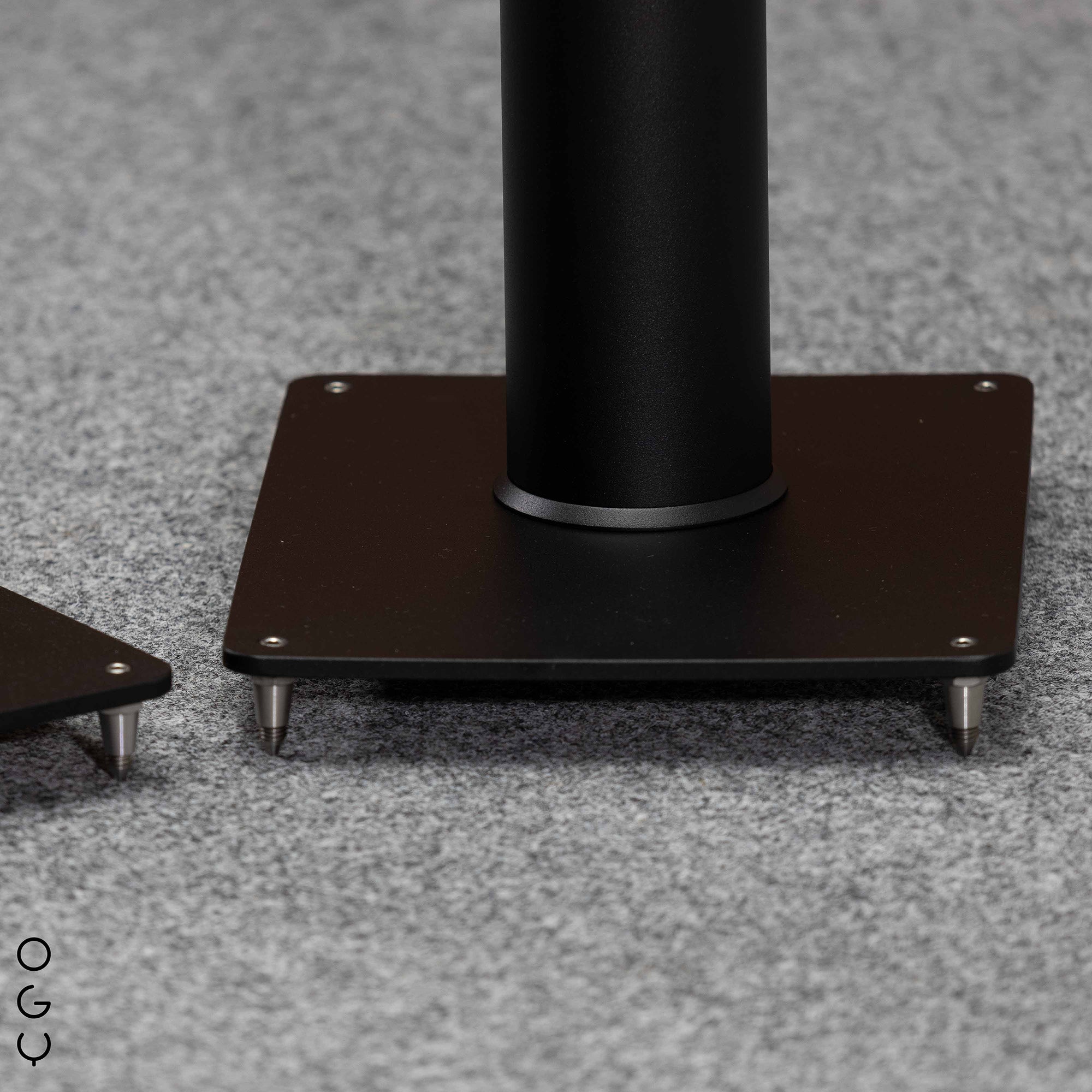 Close-up of the stand component supporting the speaker, showcasing detailed construction and material quality for Closer Acoustics OGY loudspeakers.