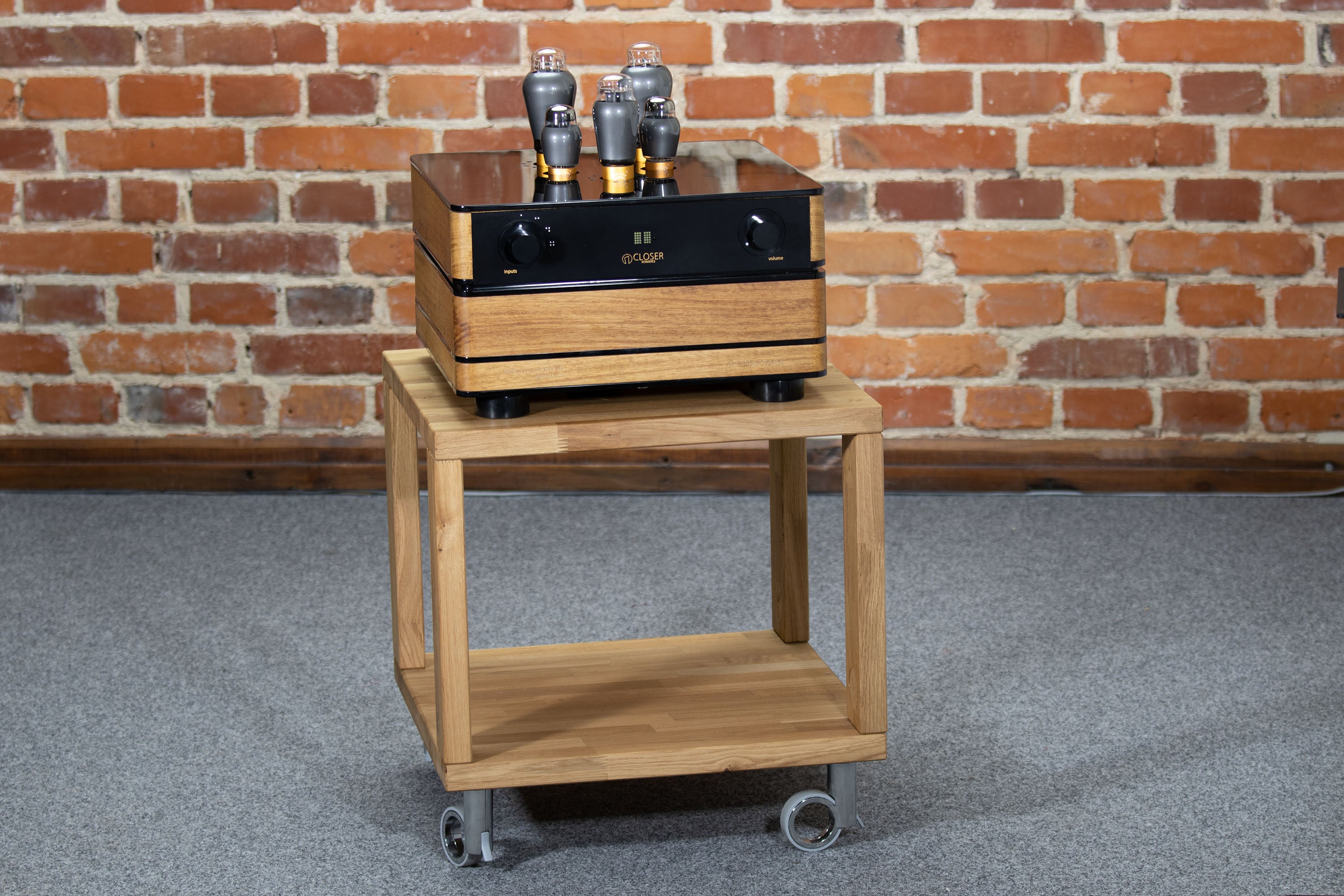Tube amplifier front view on wooden stand – Adam Sztaba model