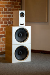 Side view of the Closer Acoustics OGY plus 2 x BOBs set with maple veneered sides, illustrating the elegant wood finish and sleek design of the speaker setup