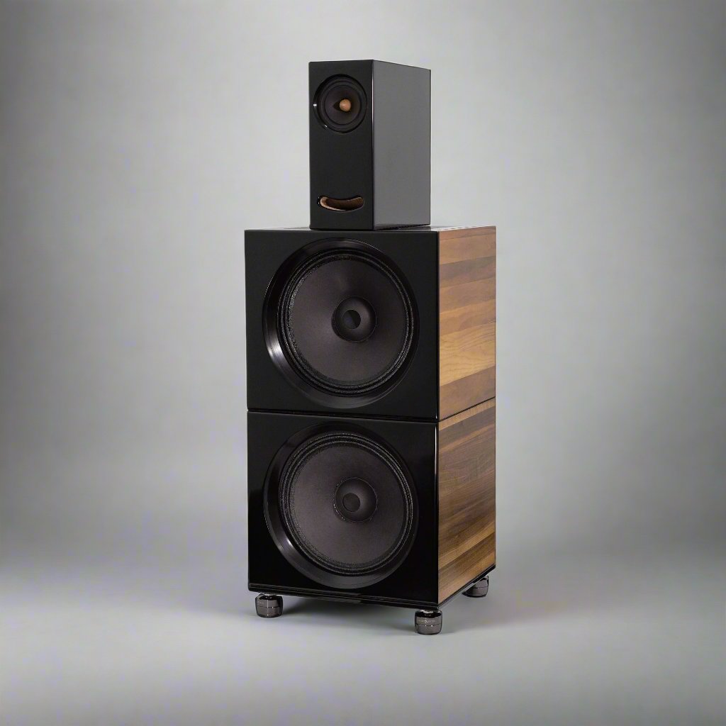 Closer Acoustics OGY Plus 2 x BOBs set with piano black fronts and walnut veneered sides, captured in a studio setting, showcasing their elegant design and high-end finish.