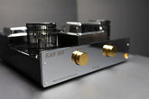 Close-up view of the Yoshino Ear 869 amplifier showing precision volume knobs and high-quality build