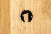 Closer Acoustics logo on Forlane speaker base – branding in natural wood finish