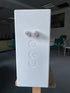 Rear view of the white Closer Acoustics Ogy speaker, highlighting its sleek design and premium build quality