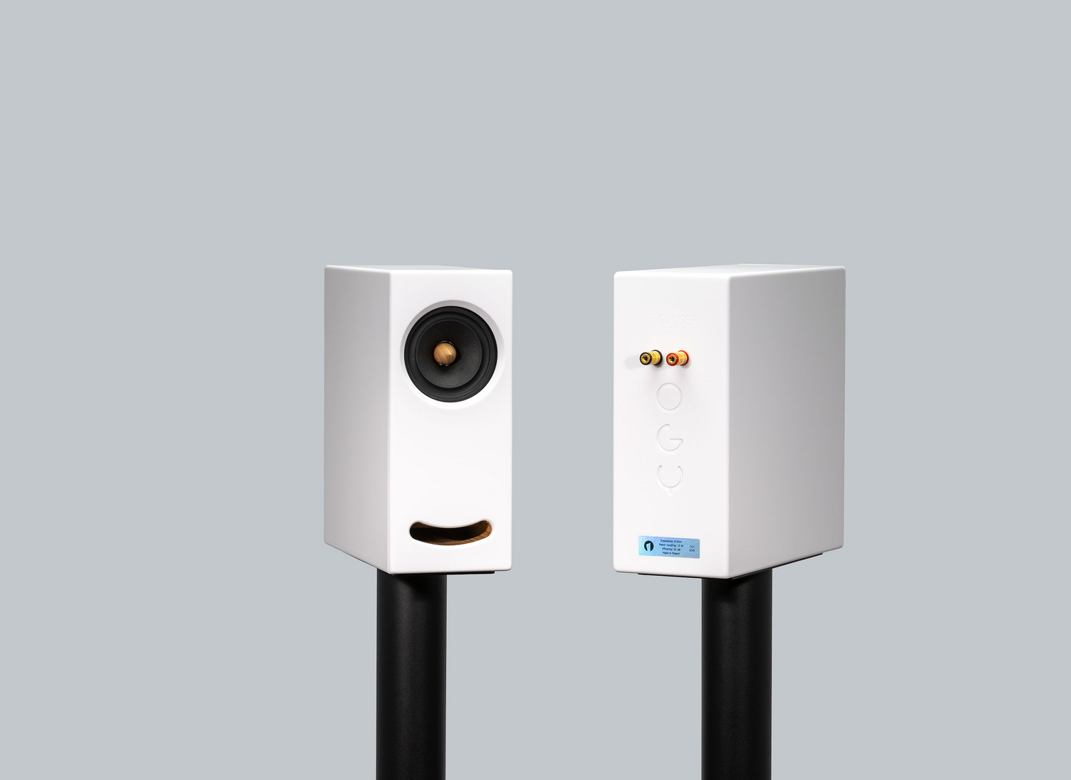 OGY White Corian bookshelf speakers – blending superior sound with modern design on black stands