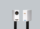 OGY White Corian bookshelf speakers – blending superior sound with modern design on black stands