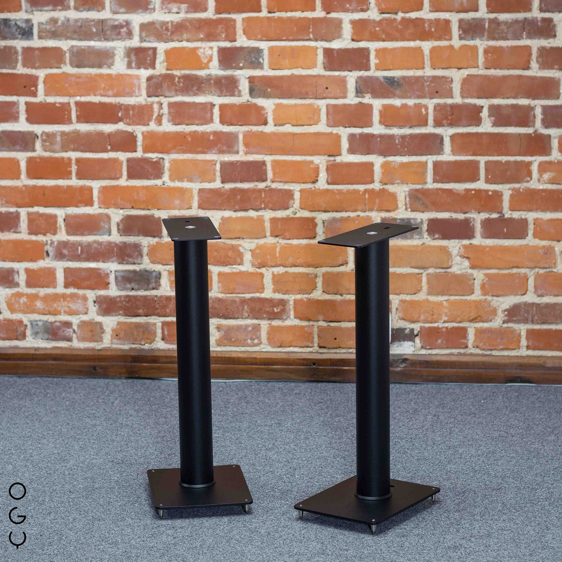 Pair of ER 700 stands designed for Closer Acoustics OGY Bookshelf Loudspeakers, showcasing a sleek and functional design that complements the speakers.