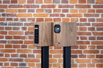 Closer Acoustics OGY bookshelf loudspeakers – pair in walnut veneer, side view, highlighting the sleek lines and premium quality construction of the speakers
