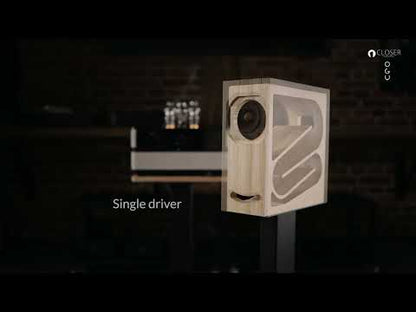 OGY speaker internal transmission line and tube amplifier on black background
